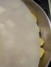 Potatoes and Butter Under Disc of Parchment